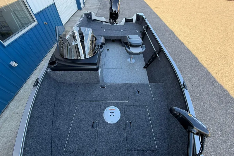 Slide: The Image of 2026 Crestliner 1650 Kodiak fishing boat with spacious deck and seating. - 13