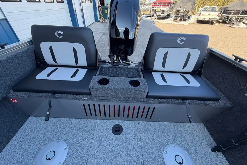 Slide: The Image of 2026 Crestliner 1650 Kodiak boat interior with dual seats and motor. - 16