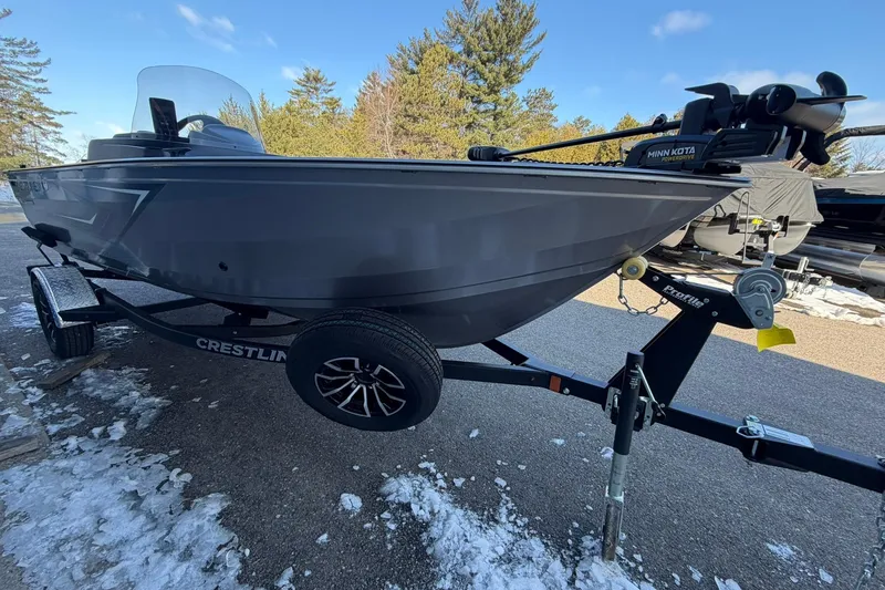 Slide: The Image of 2026 Crestliner 1650 Kodiak boat on trailer, parked on snowy ground. - 5