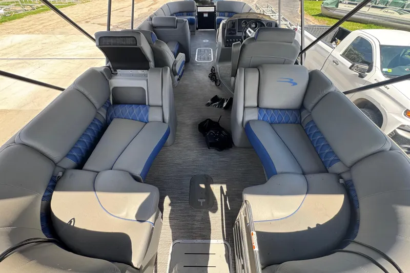 Slide: The Image of 2020 Bennington R 25 RFB pontoon boat interior with gray and blue seating. - 15
