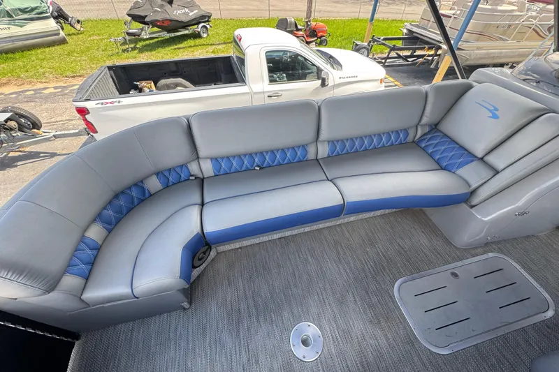 Slide: The Image of 2020 Bennington R 25 RFB boat interior with gray and blue seating. - 8
