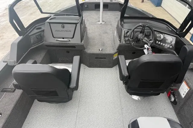 Slide: The Image of Interior of 2026 Crestliner 2050 Fish Hawk boat with dual seats and steering console. - 10
