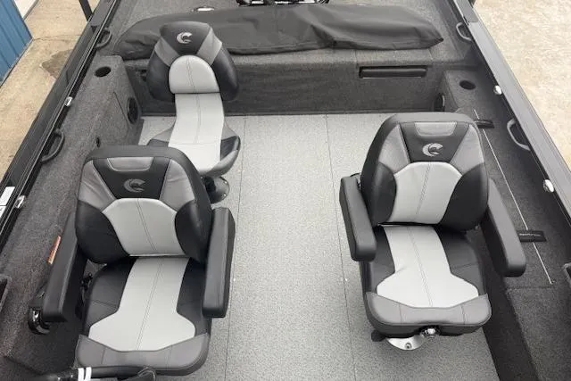 Slide: The Image of 2026 Crestliner 2050 Fish Hawk interior with two gray and black swivel seats. - 11