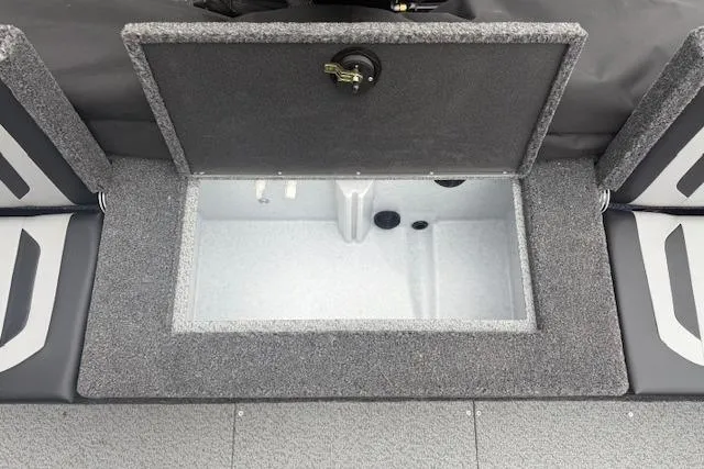 Slide: The Image of 2026 Crestliner 2050 Fish Hawk livewell compartment with open lid, showcasing spacious interior. - 13