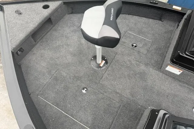 Slide: The Image of 2026 Crestliner 2050 Fish Hawk boat interior with swivel seat and carpeted deck. - 18