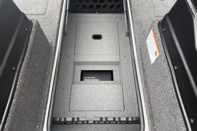 Slide: The Image of Interior view of 2026 Crestliner 2050 Fish Hawk boat, featuring storage compartment. - 19