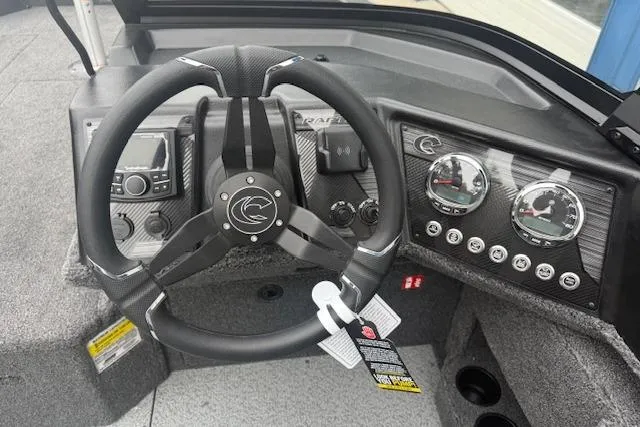 Slide: The Image of 2026 Crestliner 2050 Fish Hawk dashboard with steering wheel and instrument panel. - 22