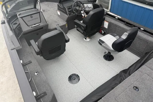 Slide: The Image of 2026 Crestliner 2050 Fish Hawk boat interior with seating and steering console. - 24