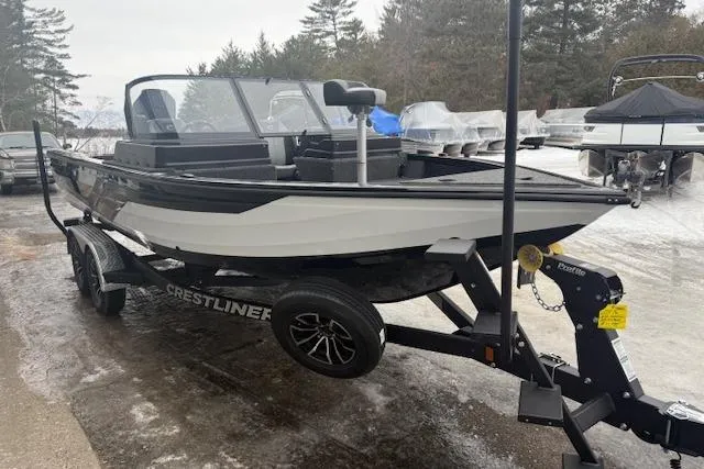 Slide: The Image of 2026 Crestliner 2050 Fish Hawk boat on trailer, parked outdoors in a snowy setting. - 6