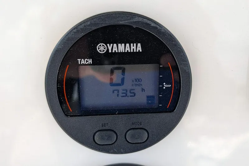 Slide: The Image of Yamaha tachometer displaying 73.5 hours on a 2022 Key West 219 FS boat. - 13