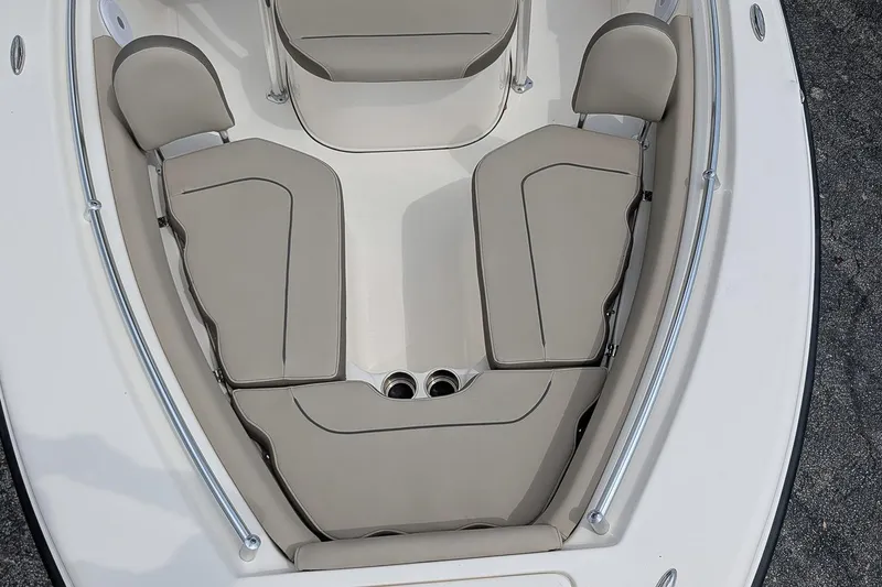 Slide: The Image of 2022 Key West 219 FS boat interior with beige seating and cup holders. - 17