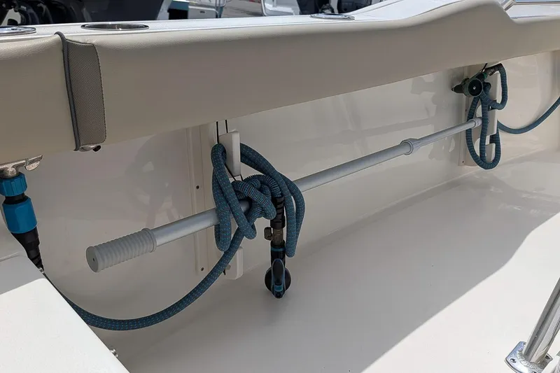 Slide: The Image of 2022 Key West 219 FS boat interior with blue rope and rod holder. - 9
