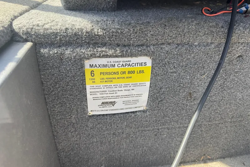 Slide: The Image of 2014 Crestliner 1650 Fish Hawk capacity label, 6 persons or 800 lbs, 90 HP motor. - 10