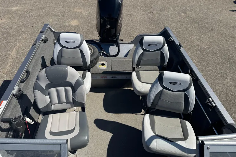 Slide: The Image of 2014 Crestliner 1650 Fish Hawk boat interior with four gray seats. - 11