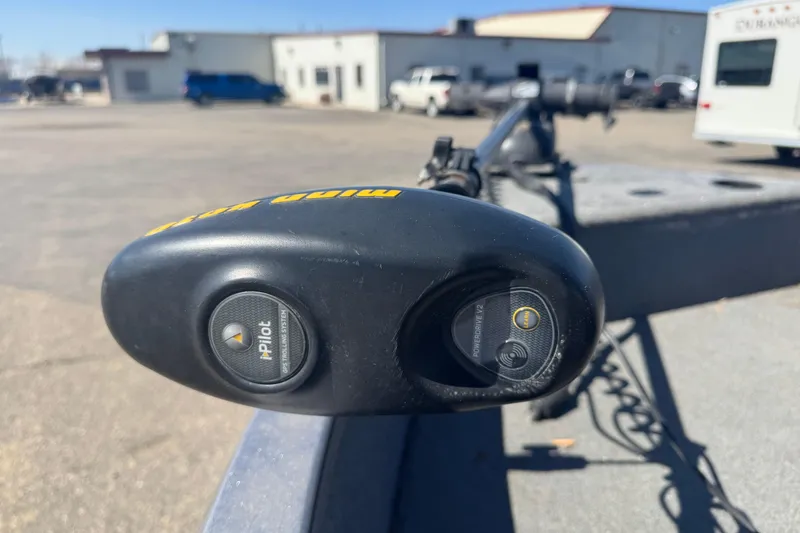 Slide: The Image of Minn Kota trolling motor on 2014 Crestliner 1650 Fish Hawk boat in parking lot. - 13