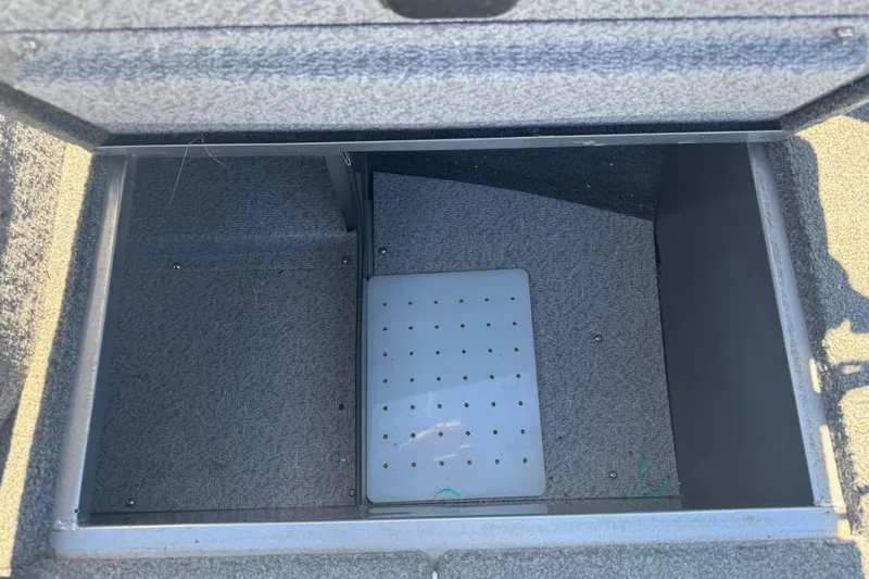 Slide: The Image of Open storage compartment in 2014 Crestliner 1650 Fish Hawk boat. - 14