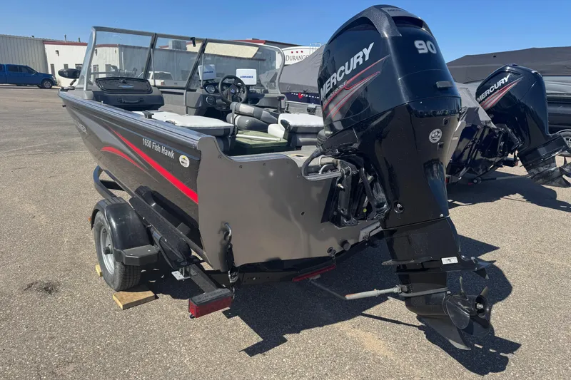 Slide: The Image of 2014 Crestliner 1650 Fish Hawk boat with Mercury 90 engine on trailer. - 4