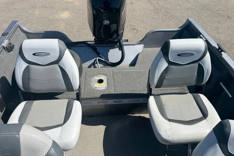 Slide: The Image of 2014 Crestliner 1650 Fish Hawk boat interior with seating and motor. - 8