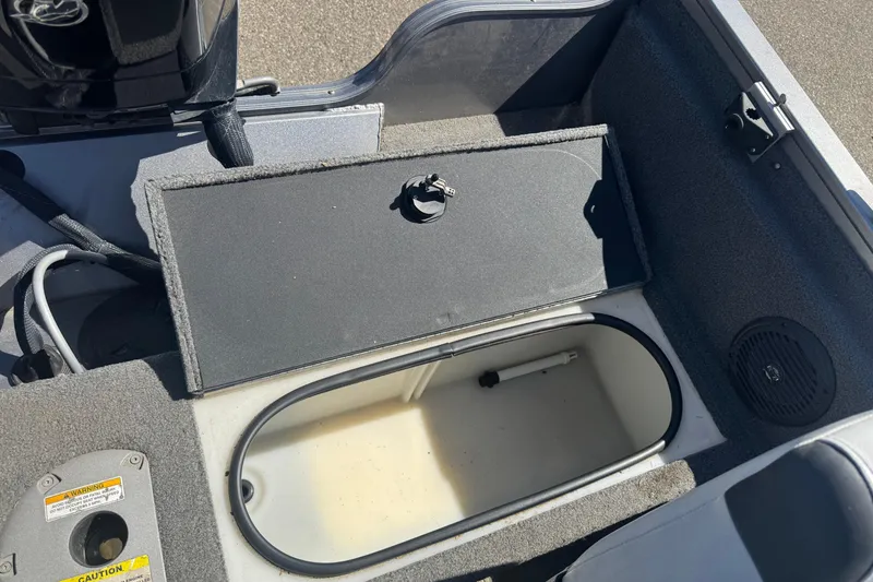 Slide: The Image of 2014 Crestliner 1650 Fish Hawk boat interior with open storage compartment. - 9