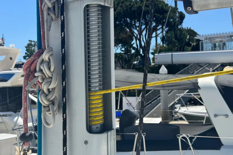 Slide: The Image of Close-up of rigging on a 2008 Beneteau 49 sailboat, featuring ropes and mast details. - 15