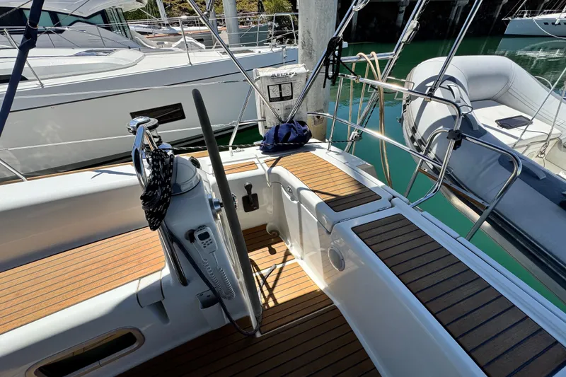 Slide: The Image of Cockpit of 2008 Beneteau 49 yacht with teak flooring and steering wheel. - 24
