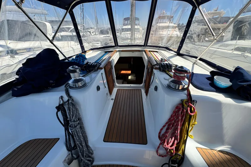 Slide: The Image of Cockpit of a 2008 Beneteau 49 sailboat with ropes and winches. - 26