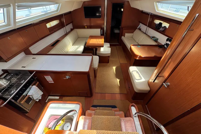 Slide: The Image of Luxurious interior of a 2008 Beneteau 49 yacht with elegant wood finishes. - 27