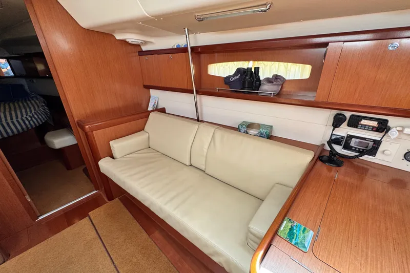 Slide: The Image of Interior of 2008 Beneteau 49 yacht with beige sofa and wooden cabinetry. - 30