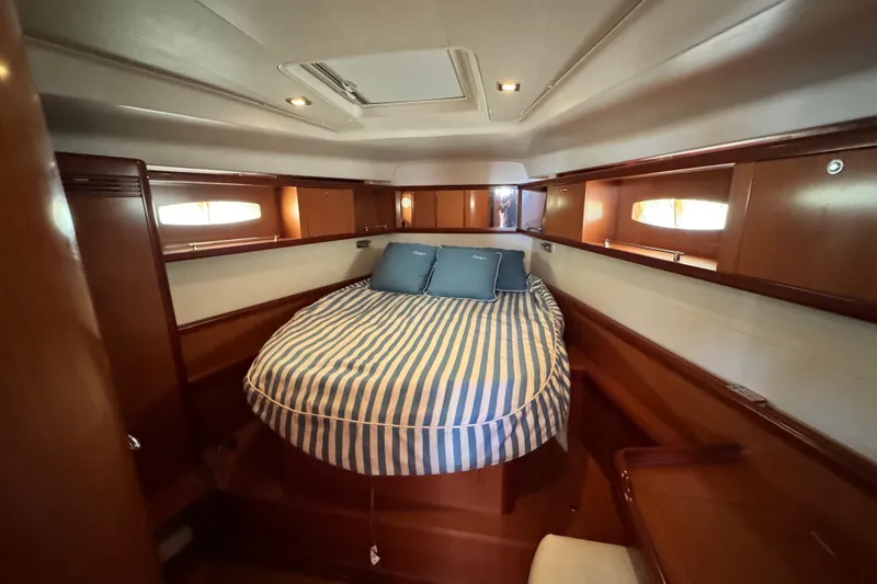 Slide: The Image of Luxurious cabin interior of 2008 Beneteau 49 yacht with striped bedding. - 35