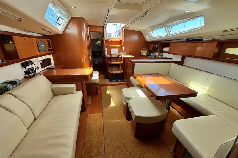 Slide: The Image of Luxurious interior of 2008 Beneteau 49 yacht with elegant seating and dining area. - 37