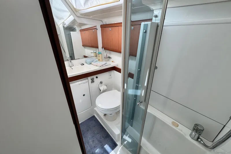 Slide: The Image of Bathroom interior of 2008 Beneteau 49 yacht with shower and wooden cabinets. - 45