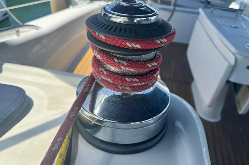 Slide: The Image of Winch with red rope on 2008 Beneteau 49 sailboat deck. - 48