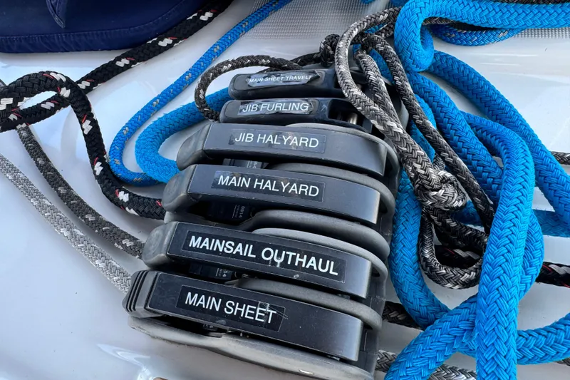 Slide: The Image of Sailing ropes and clutches on a 2008 Beneteau 49 yacht deck. - 49