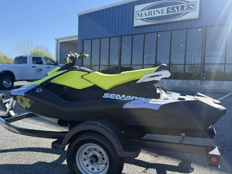 Slide: The Image of 2024 Sea-Doo Spark 3up Trixx in front of Marine Sales building. - 12