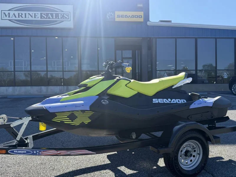 Slide: The Image of 2024 Sea-Doo Spark 3up Trixx in front of Marine Sales building. - 13