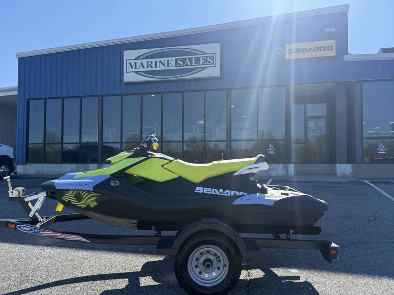 Slide: The Image of 2024 Sea-Doo Spark 3up Trixx in front of Marine Sales building. - 21