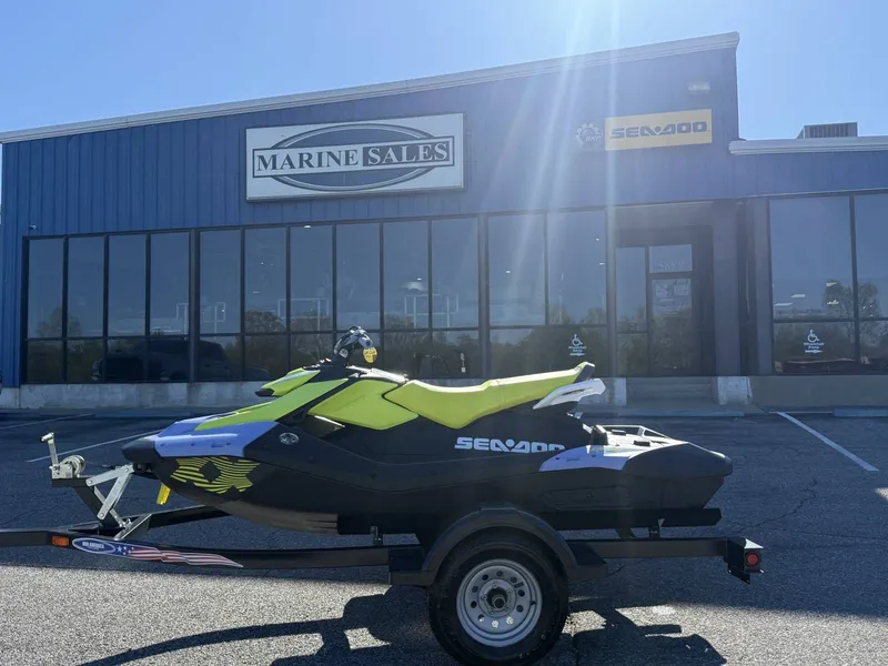 Slide: The Image of 2024 Sea-Doo Spark 3up Trixx in front of Marine Sales building. - 22