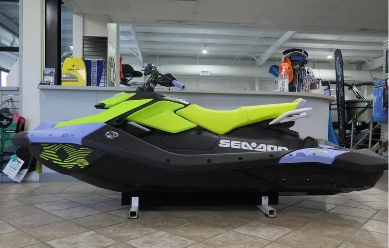 Slide: The Image of 2024 Sea-Doo Spark 3up Trixx in a showroom. - 23