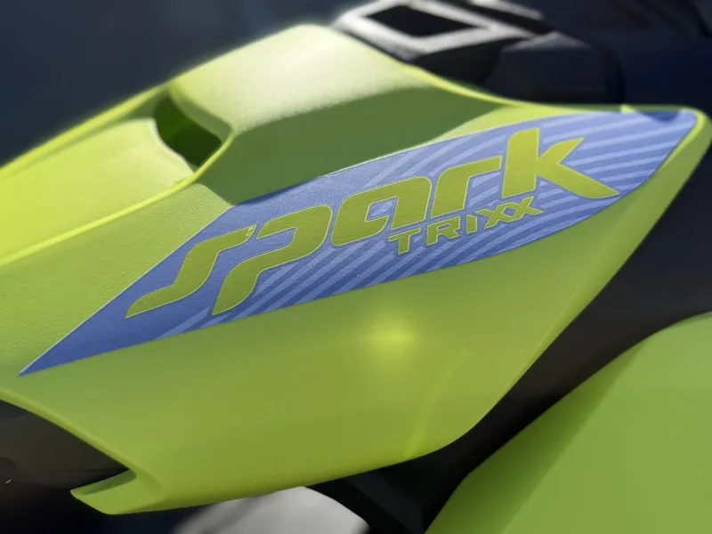 Slide: The Image of Close-up of 2024 Sea-Doo Spark Trixx in vibrant green. - 9