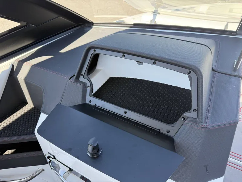 Slide: The Image of Interior of 2026 Cobalt R6 Surf with open storage compartment. - 20