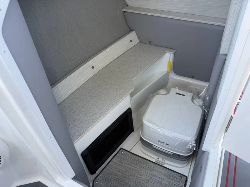 Slide: The Image of Interior of 2026 Cobalt R6 Surf featuring portable toilet. - 21