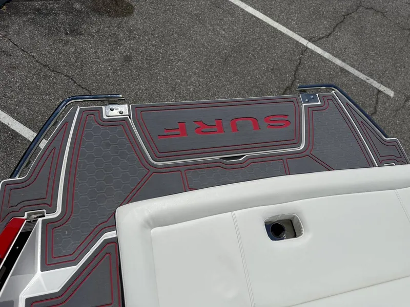 Slide: The Image of 2026 Cobalt R6 Surf boat with gray and red deck design. - 43