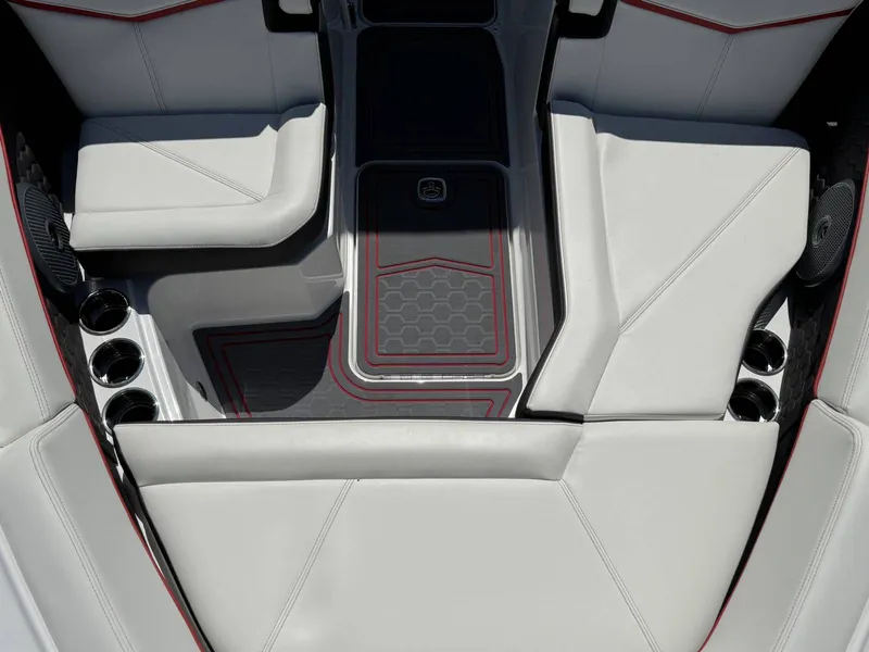 Slide: The Image of Interior of 2026 Cobalt R6 Surf with white upholstery and cup holders. - 7