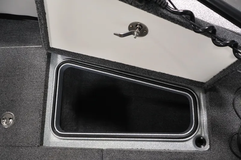 Slide: The Image of Open storage compartment in 2022 Ranger 1880MS boat, featuring a secure latch mechanism. - 16