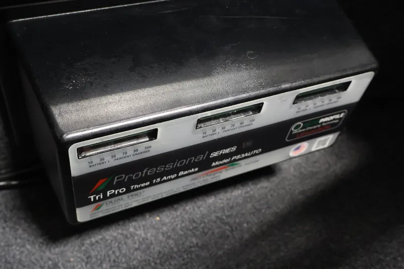 Slide: The Image of Professional Series Tri Pro battery charger in a 2022 Ranger 1880MS boat. - 18