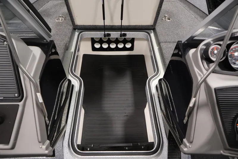 Slide: The Image of 2022 Ranger 1880MS boat interior with storage compartment and dashboard controls. - 19