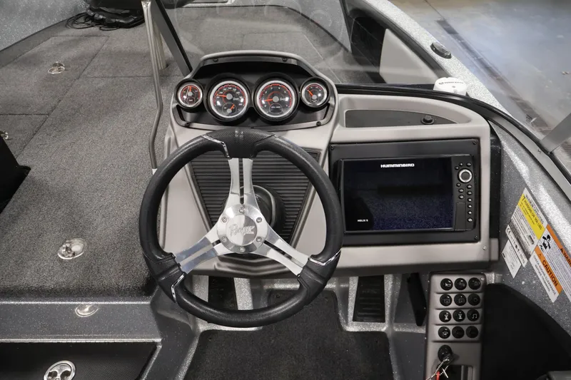 Slide: The Image of 2022 Ranger 1880MS boat dashboard with steering wheel, gauges, and Humminbird electronics. - 21