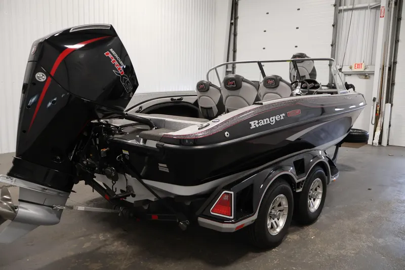 Slide: The Image of 2022 Ranger 1880MS boat with powerful outboard motor in a garage setting. - 4