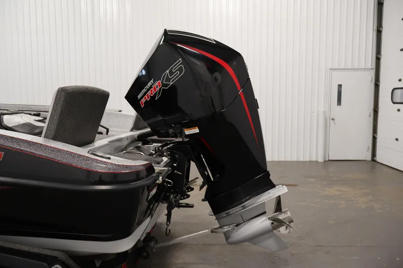 Slide: The Image of 2022 Ranger 1880MS boat with Mercury Pro XS outboard motor in a garage setting. - 41