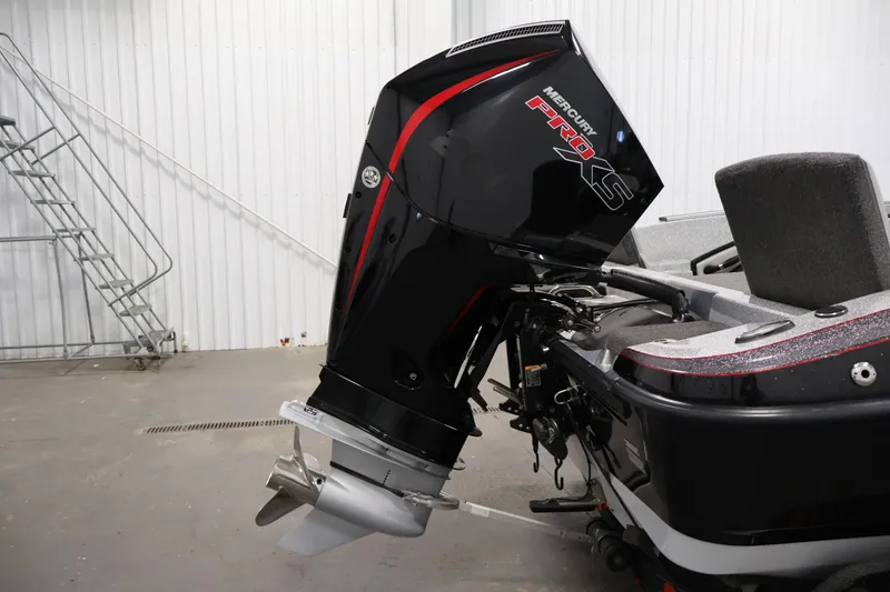 Slide: The Image of 2022 Ranger 1880MS boat with Mercury Pro XS outboard motor in a garage setting. - 42